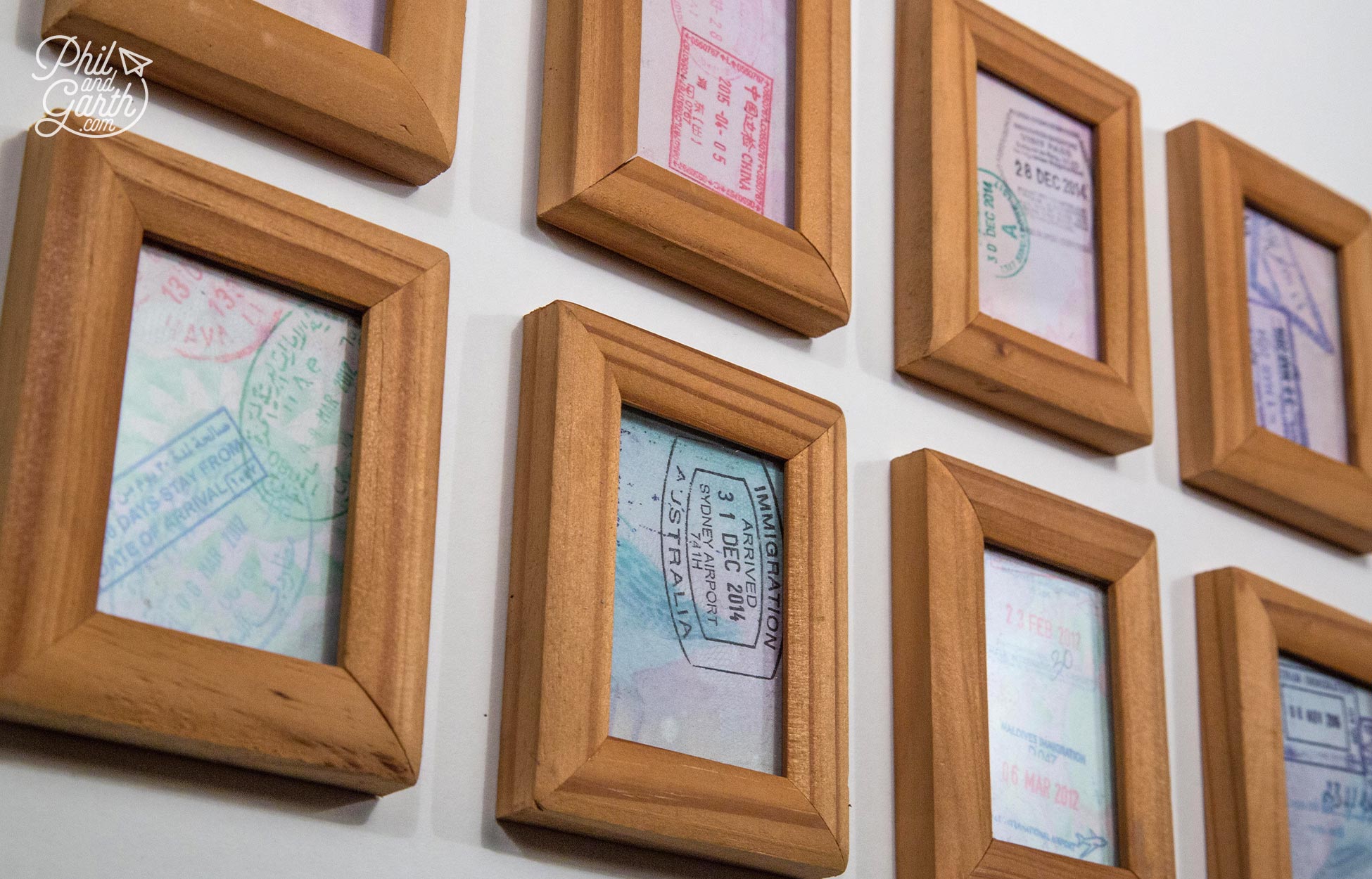 Cut up your old passport pages and put them inside little frames