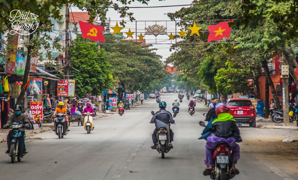 The Communist Party hammer and sickle alongside the Vietnamese flag