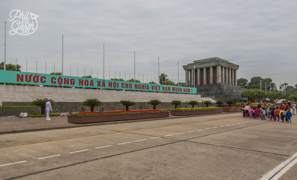 The Ho Chi Minh Mausoleum, the text reads "Socialist Republic of Vietnam forever!"