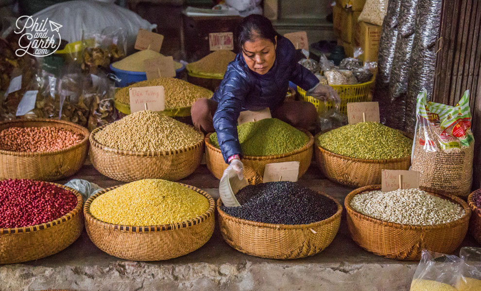 This lady had baskets of beans and different varieties of rice