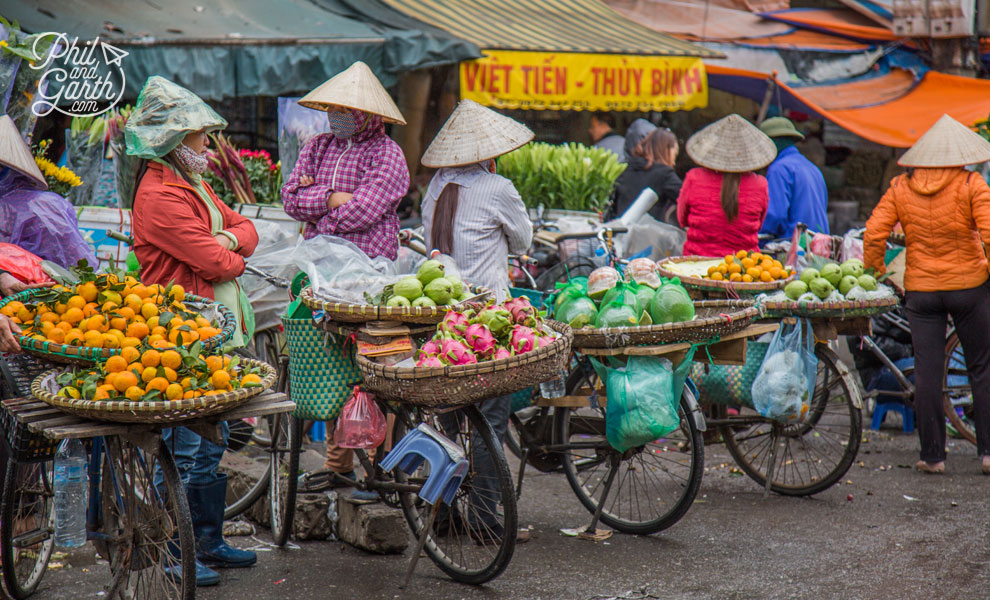 Fruit vendors in their iconic conical hats