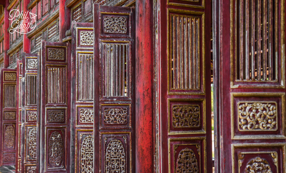 Ornate wooden doors line remaining hallways