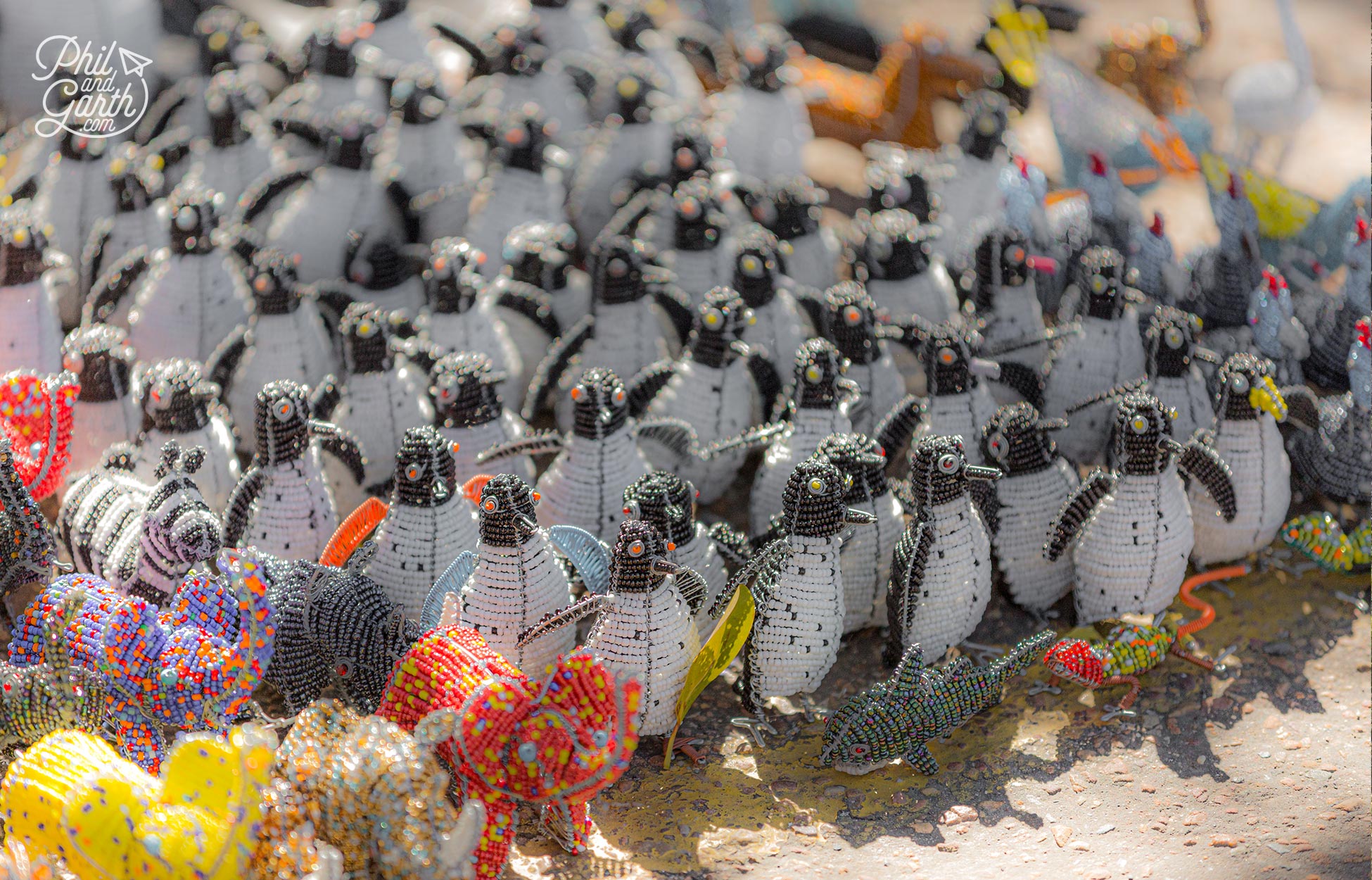 Loads of penguin themed souvenirs outside Boulders