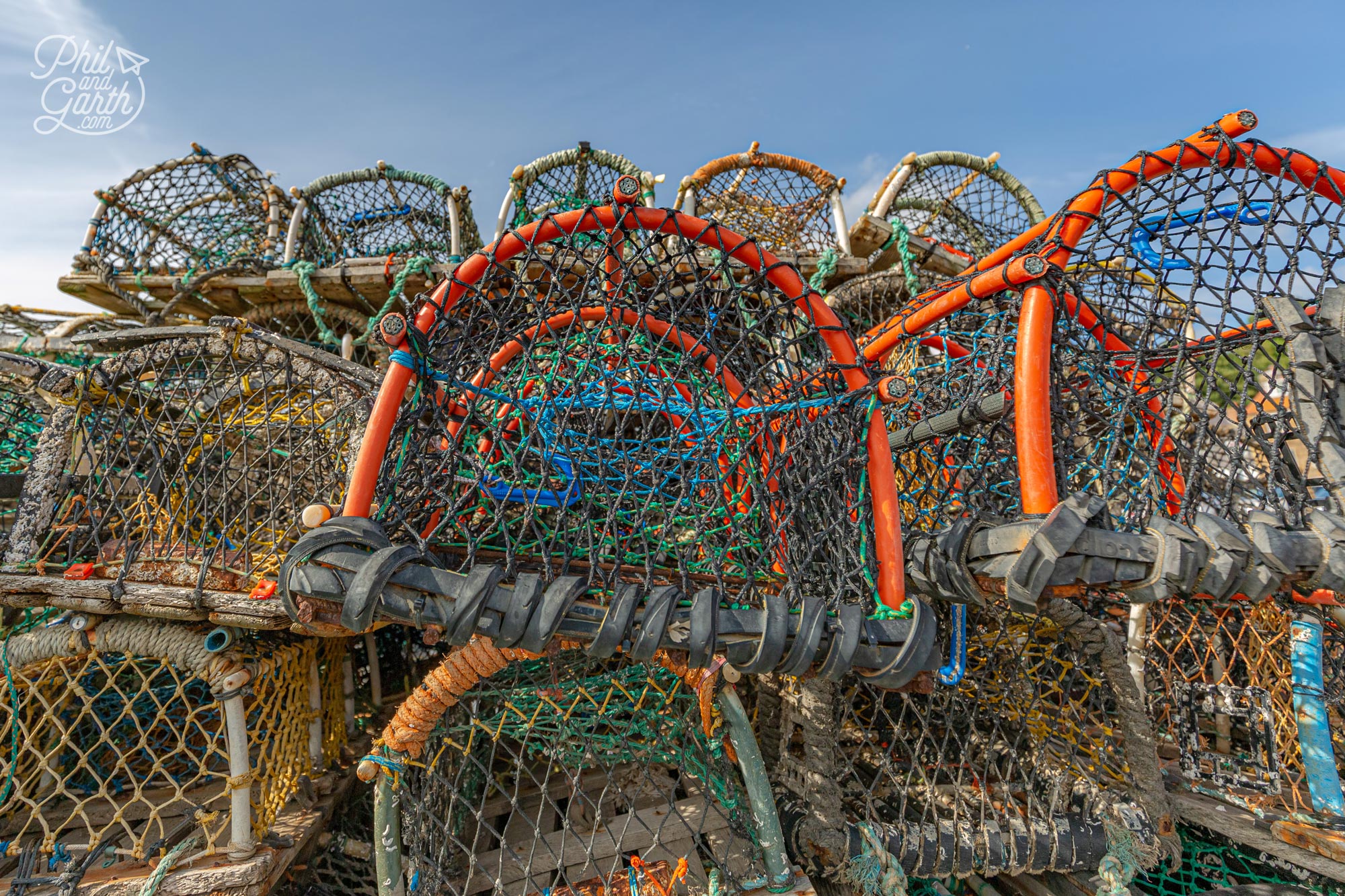 Lobster pots line the harbour, used by fishermen to catch lobsters, crayfish and crabs