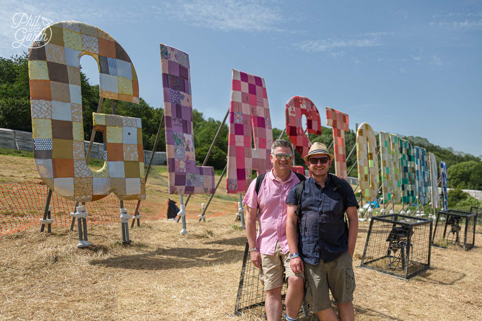 Phil and Garth at the Glastonbury sign