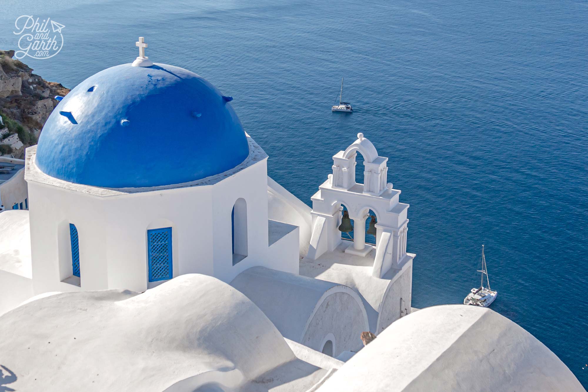 The blue domes of Santorini and the glittering Aegean Sea