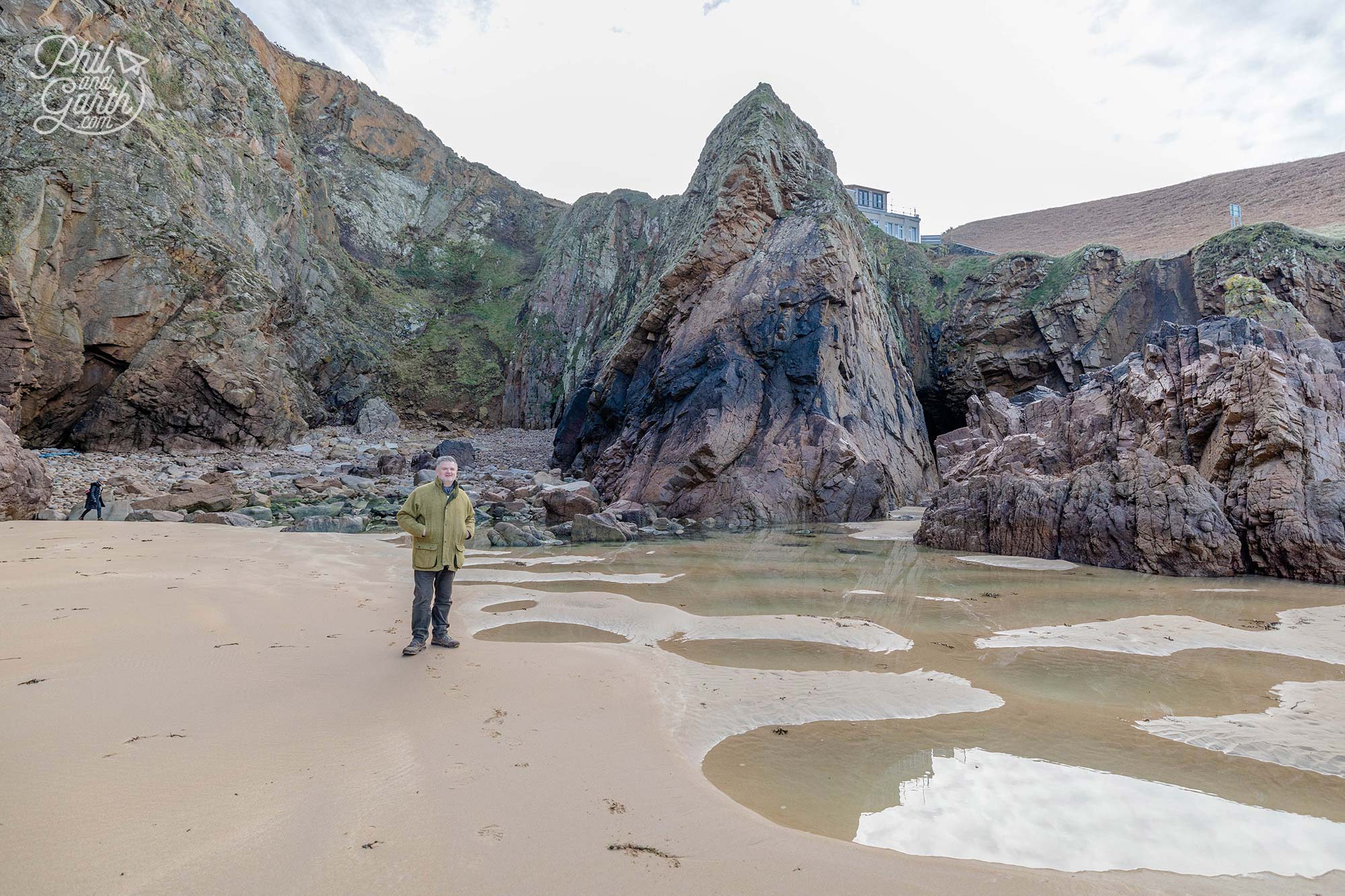 Phi next to a secluded cove with turquoise waters at Plémont Bay