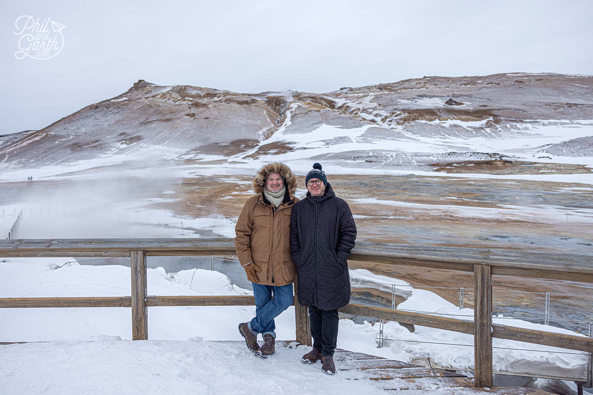 Phil and Garth standing next to the deadly boiling mud pools at Hverir