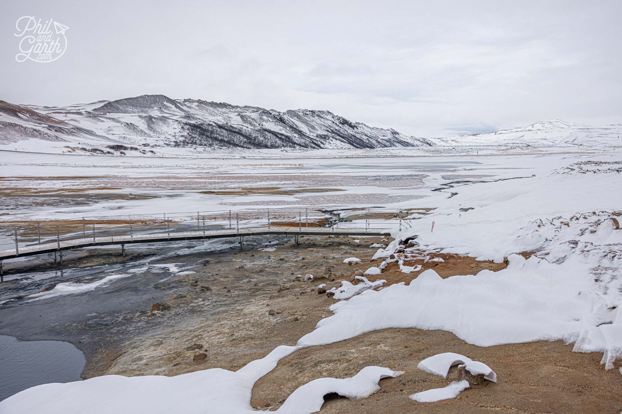 The vast, steaming expanse of Hverir with mountains in the background